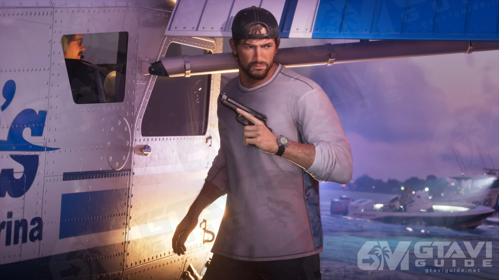 Jason holding a pistol beside a seaplane at night, a speedboat behind him