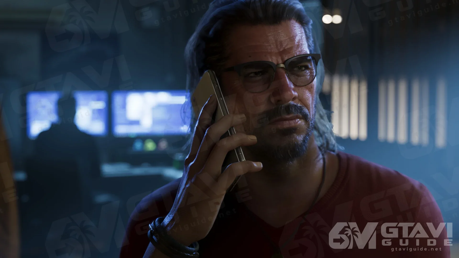 Raul wearing glasses and talking on a phone.