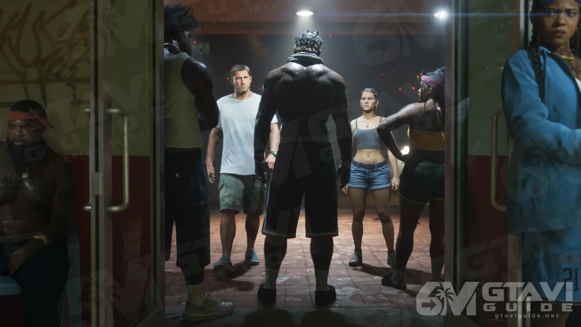 Jason, Lucia and a group of people walking through a doorway